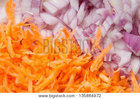 background of shredded carrots and red onion
