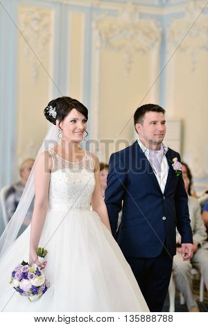 Beauty Bride And Handsome Groom Are Registering The Marriage. Wedding Couple Is Marrying. Beautiful