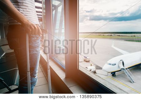 Woman With Her Baggage Waiting For Her Flight
