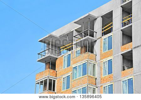 Building construction site work against blue sky
