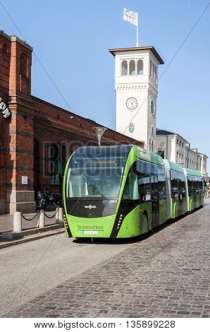 MALMO SWEDEN - AUGUST 17 2015: The new Malmoexpressen is a greener way to travel the city. Here in front of the old Centralstation in Malmo Sweden.