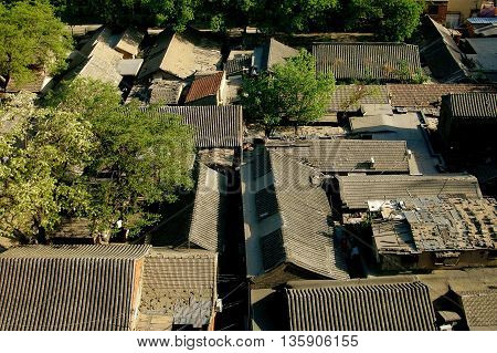 Beijing China - May 1 2005: View over the tiled rooftops of the Wang Fu Jing Hutong in the center of the city