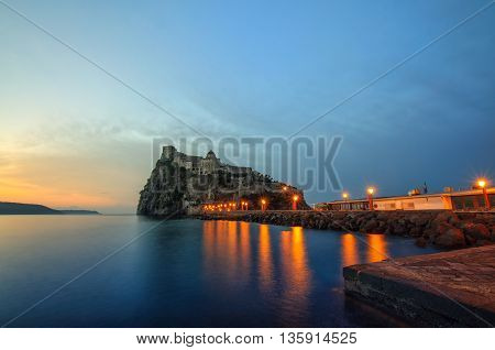 Aragonese castle at sunrise. Mediterranean Sea coast bay of Naples Ischia island Italy