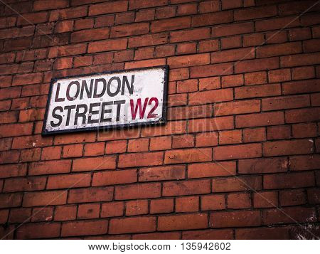 London Street Sign On A Red Brick Wall