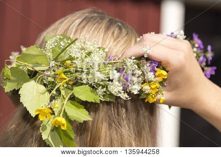 Swedish Midsummer Headgear Traditional on a female head of hair.