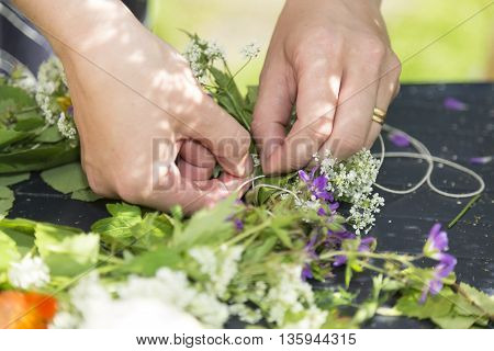 Woman Making a Swedish Midsummer Head Creation.