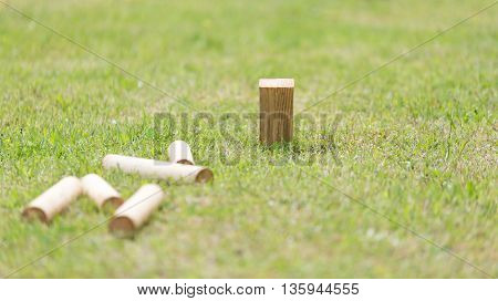Swedish Lawn Game Kubb on grass close up.
