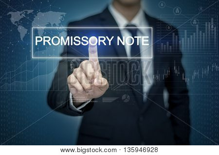 Businessman hand touching PROMISSORY NOTE button on virtual screen