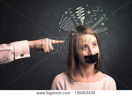 Caucasian hand pointing at scared female employee