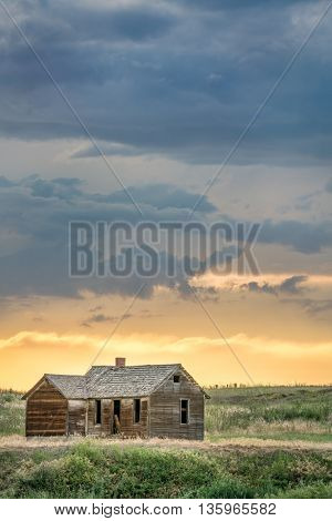 old abandoned farmhouse on a prairie, St Vrain State Park near Longmont, Colorado