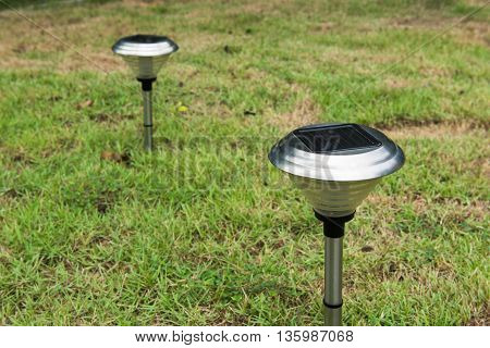 Solar Light in the grass. Clean energy is popular. For Earth, Superfund