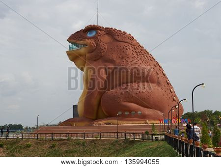 MUSEUM SERPENT KARK, YASOTHON, THAILAND - JUNE 19, 2016: Local people and tourists visit the new public landmark (Pha Ya Kan Kark or Toad King statue) of Yasothon province, in the northeastern of Thailand.