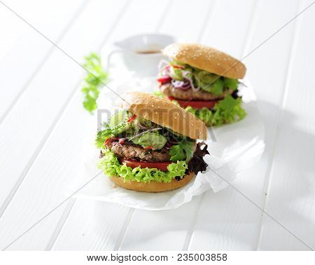 Homemade Fresh Hamburger In Sesame Bun With Lettuce, Tomato, Cumber And Onion,
