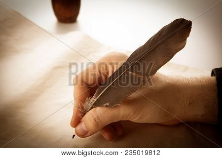 Writer Holds A Fountain Pen Over Writing Paper And A Signature Closeup