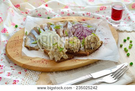 Vorschmack With A Herring On Wood Board.