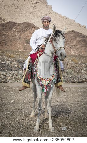 Omani Man On A Horse In  Rural Oman