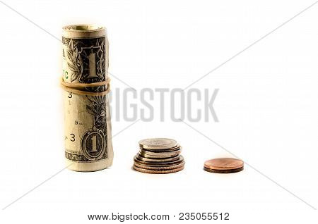Dollar Bills And Coin Pile Over A White Background. Symbol Of Gain Increase