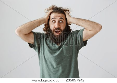 What Have You Done, It Is Terrible. Shocked And Frustrated Eastern Man With Beard, Holding Hands On 