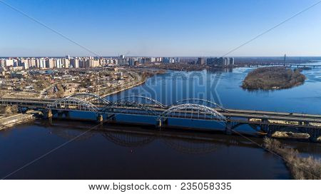 Aerial View Of The City, Ukraine. Dnieper River With Bridges. Darnitskiy Bridge. Combined Railway An