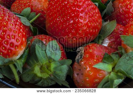 Background From Freshly Harvested Strawberries, Directly Above.  A Real Real Strawberry.