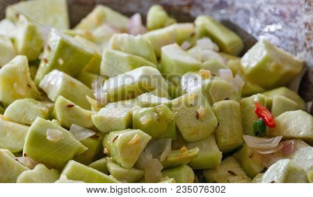 Vegetables Of Ridge Gourd Stewed With Spices In A Frying Pan