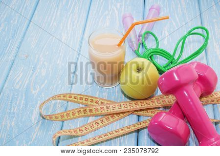 The Concept Of A Healthy Diet. Small Dumbbells, Juice. Bananas. Oranges. Apples. Healthy Lifestyle. 