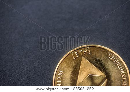 Golden Virtual Money Ethereum Crypto Currency Coin On A Dark Background.