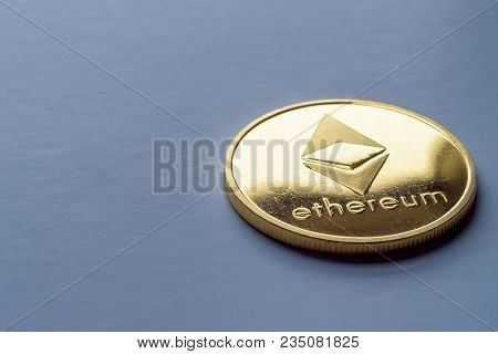 Golden Virtual Money Ethereum Crypto Currency Coin On A Dark Background.