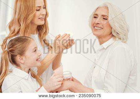 Prettier Than Yesterday. Side View On Three Generations Of Women Spending Free Time Together And Tak