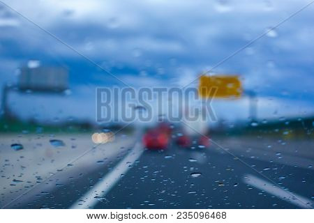 Driving In The Rain, Drivers View From Car, Out Of Focus, Highway