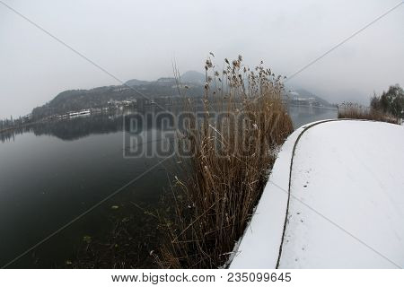 Winter Landscape With Snow And Lake Called Lago Di Fimon In Northern Italy Photographed By Fisheye L