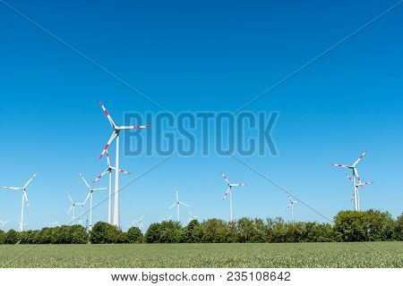 Wind Generators Under A Blue Sky Seen In Germany
