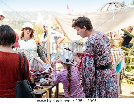Goren, Israel, April 06, 2018 : A Participant In The Knight Festival Shows Visitors How To Weave Wit
