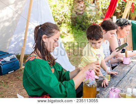 Goren, Israel, April 06, 2018 : A Participant In The Knight Festival Shows Visitors How To Prepare A