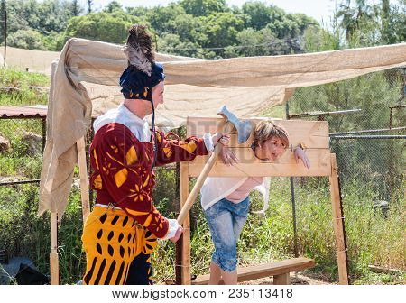 Goren, Israel, April 06, 2018 : A Visitor Of A Knight Festival Poses Shackled With An Executioner In