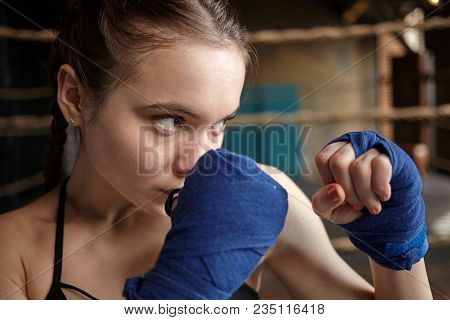 Sports, Determination And Endurance Concept. Close Up Shot Of Serious Concentrated Teenage Girl Clen