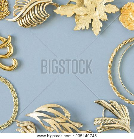 Woman's Jewelry. Vintage Jewelry Background. Beautiful Gold Tone Brooches, Braceletes, Necklaces And