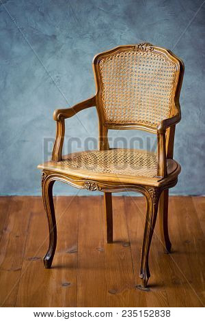 Old Chair On A Gray Wall Background