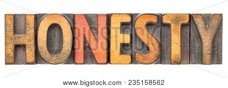 honesty  - isolated word abstract in vintage letterpress wood type block stained by color inks