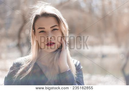Outdoors Portrait Of Beautiful Young Brunette Girl. Woman Smiling Happy On Sunny Summer Or Spring Da