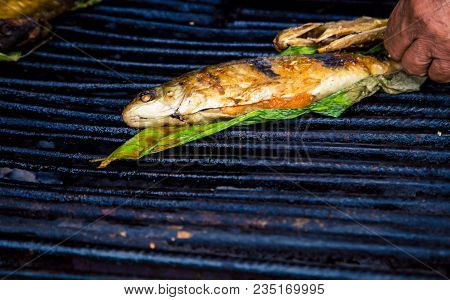 Fish Cooking On A Grill At The Belen Market In Iquitos Peru