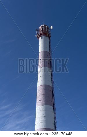 Old Brick Factory Chimney, Used As A Tower Of Cellular And Distant Radio Communication, Against The 