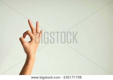 Right Hand Making Sign Ok On White Background.
