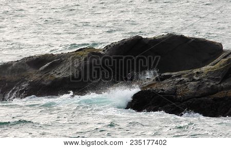 Ocean Wave And Fisherman At Depoe Bay