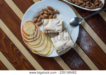Square Shape Sliced Omemade Apple Pie With Kumquats And Almonds