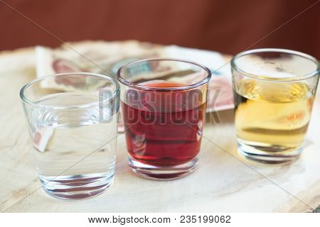 Booze And Money On A Wooden Stump Instead Of Taking Off In A Cafe