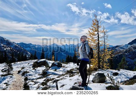 Travel Pacific Northwest. Young Woman On Vacation Hiking In Cascade Mountains. Mount Rainier Nationa