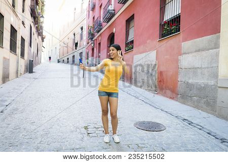Latin Woman Taking Selfie While On Holidays In Madrid
