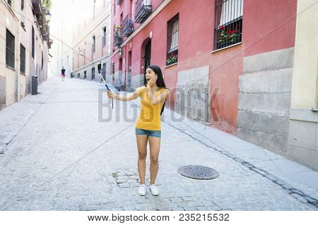 Latin Woman Taking Selfie While On Holidays In Madrid