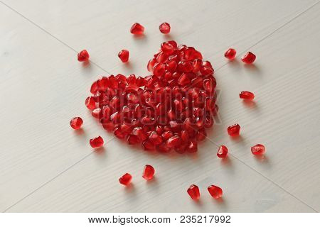 Red Heart Of Grenades. Big Ripe Red Granets Or Garnets. Fruits Of Red Ripe Pomegranate On The White 
